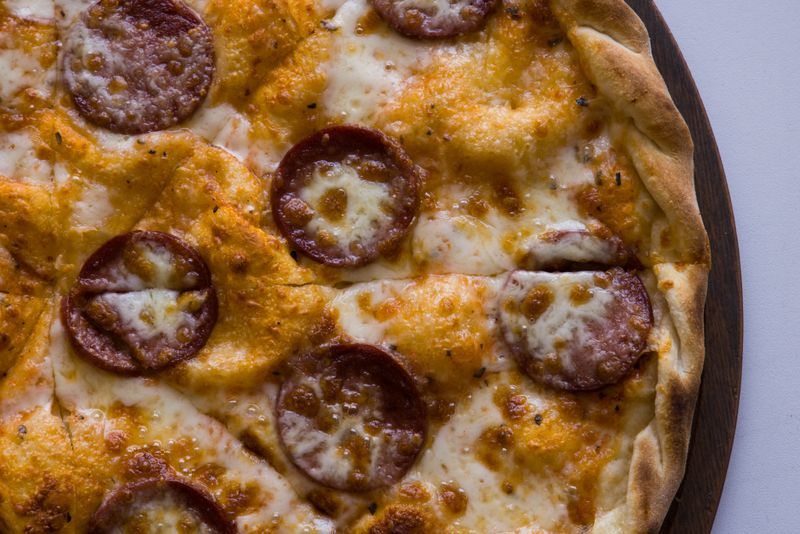 Spicy diavola thin crust pizza with spicy salami