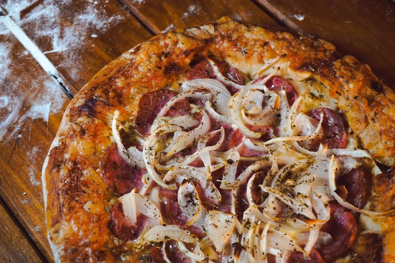 Pepperoni deep dish pizza with golden caramelized crust
